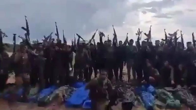 DRG forces celebrate in front of bodies of slain Maoists